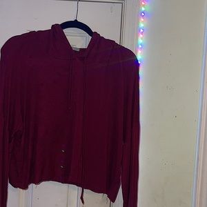 This is a marrom crop top hoodie